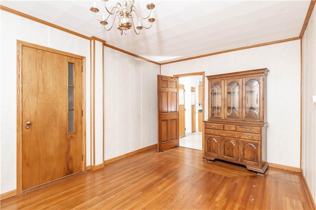845 Grisemore Road Clymer, PA 15728 - Photo 12 of 21 a view of a hallway with wooden floor and cabinet