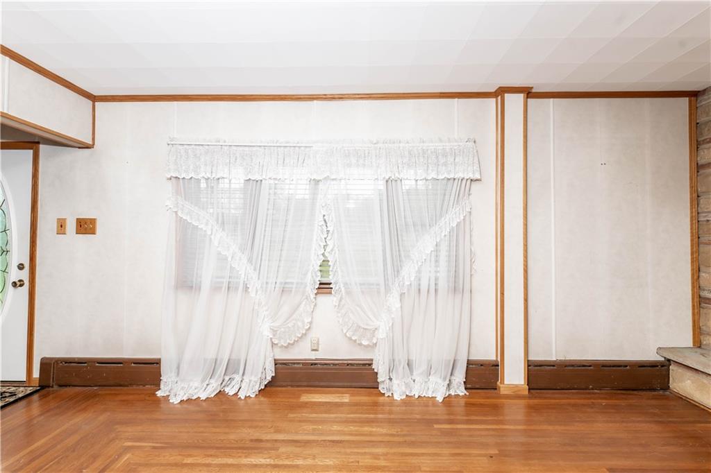 845 Grisemore Road Clymer, PA 15728 - Photo 14 of 21 a view of a bedroom with wooden floor and door