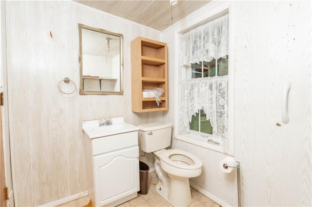 845 Grisemore Road Clymer, PA 15728 - Photo 21 of 21 a bathroom with a toilet sink and a mirror