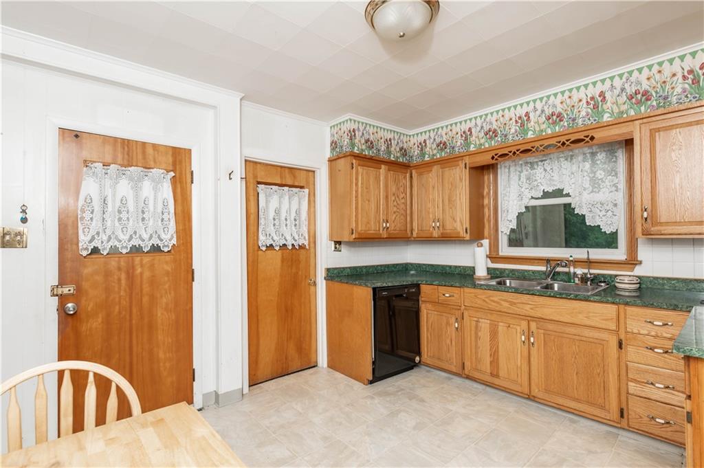845 Grisemore Road Clymer, PA 15728 - Photo 10 of 21 a kitchen with stainless steel appliances granite countertop a sink a stove and a refrigerator