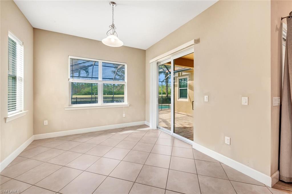 7975 Princeton Drive Naples, FL 34104 - Photo 13 of 28 a view of an empty room with windows