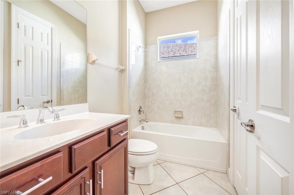 7975 Princeton Drive Naples, FL 34104 - Photo 20 of 28 a bathroom with a sink a toilet and a bathtub
