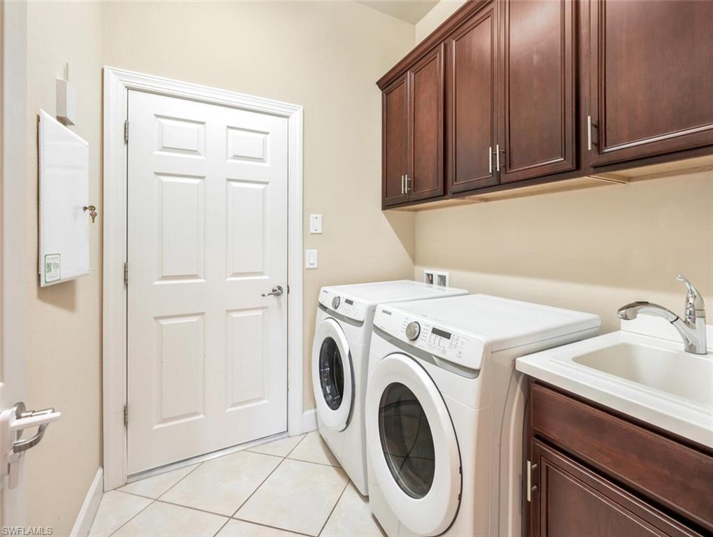 7975 Princeton Drive Naples, FL 34104 - Photo 22 of 28 a utility room with dryer and washer