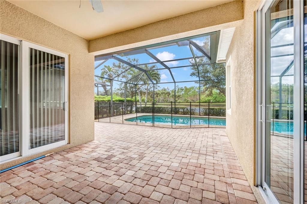 7975 Princeton Drive Naples, FL 34104 - Photo 24 of 28 a view of empty room with wooden floor and fan