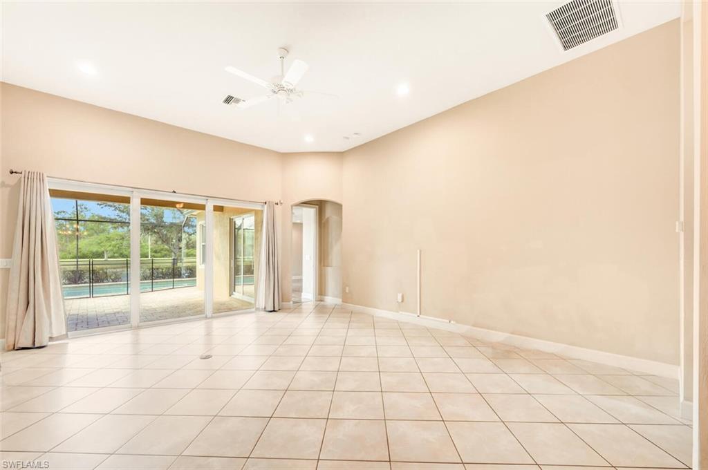 7975 Princeton Drive Naples, FL 34104 - Photo 9 of 28 a view of an empty room with a window