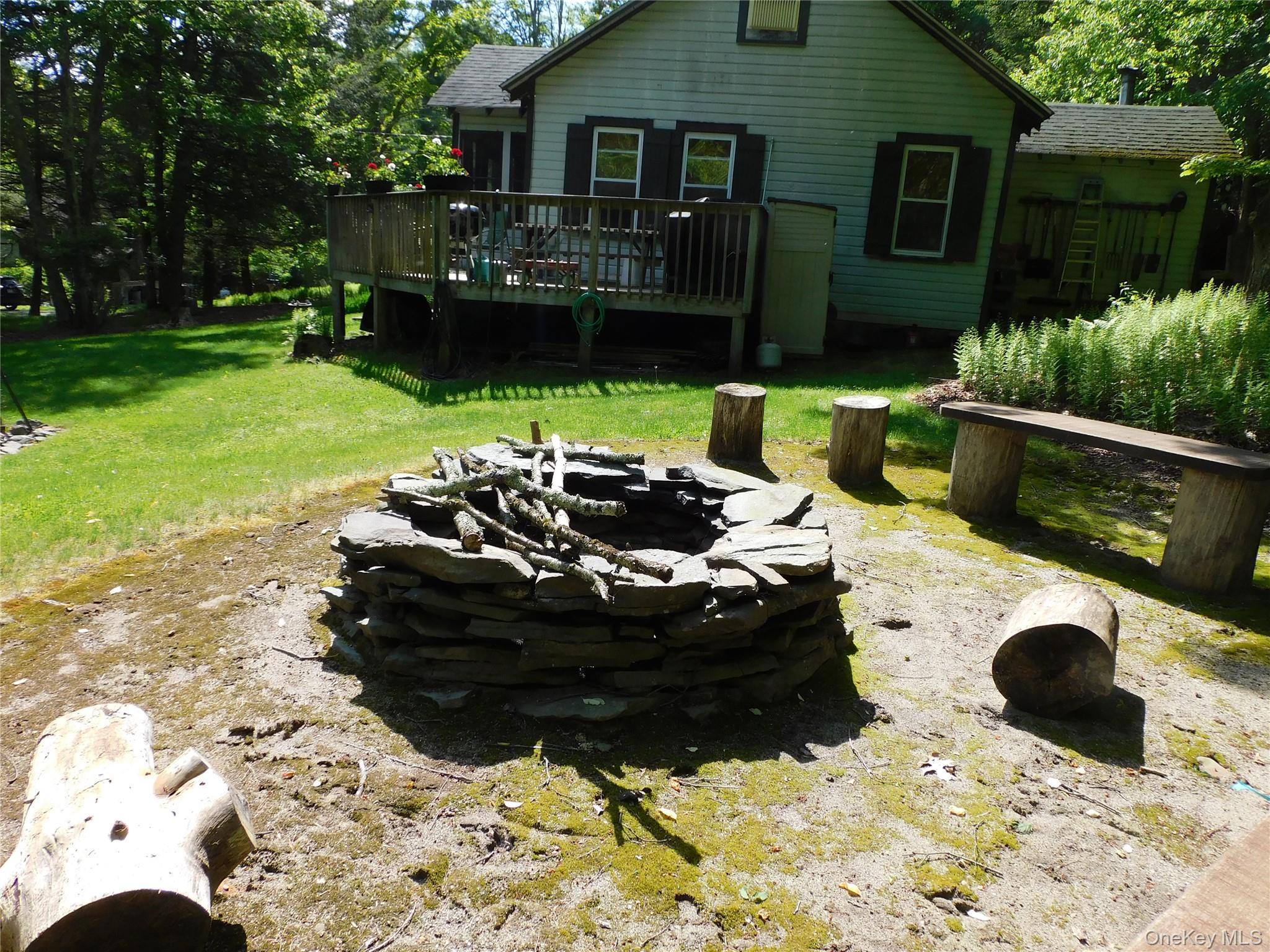18-20 Church Road Mountain Dale, NY 12763 - Photo 11 of 20 a view of a chairs and fire pit in the yard