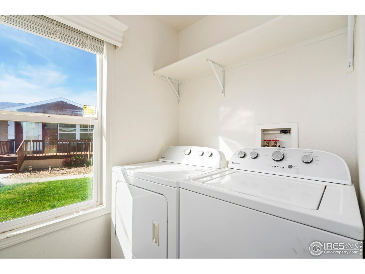 4324 Buffalo Trail Evans, CO 80620 - Photo 11 of 16 a utility room with dryer and washer