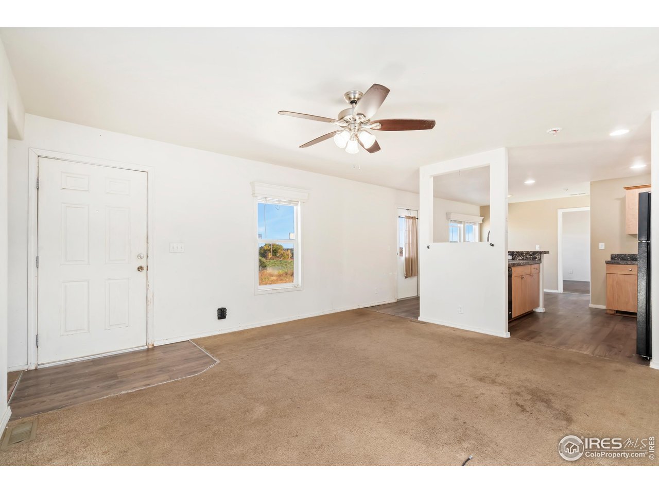 4324 Buffalo Trail Evans, CO 80620 - Photo 3 of 16 a view of an empty room with a window
