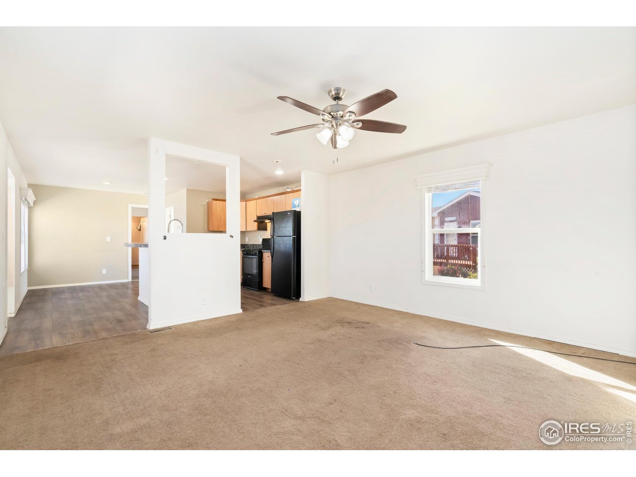 4324 Buffalo Trail Evans, CO 80620 - Photo 4 of 16 a view of a room with cabinet and a ceiling fan