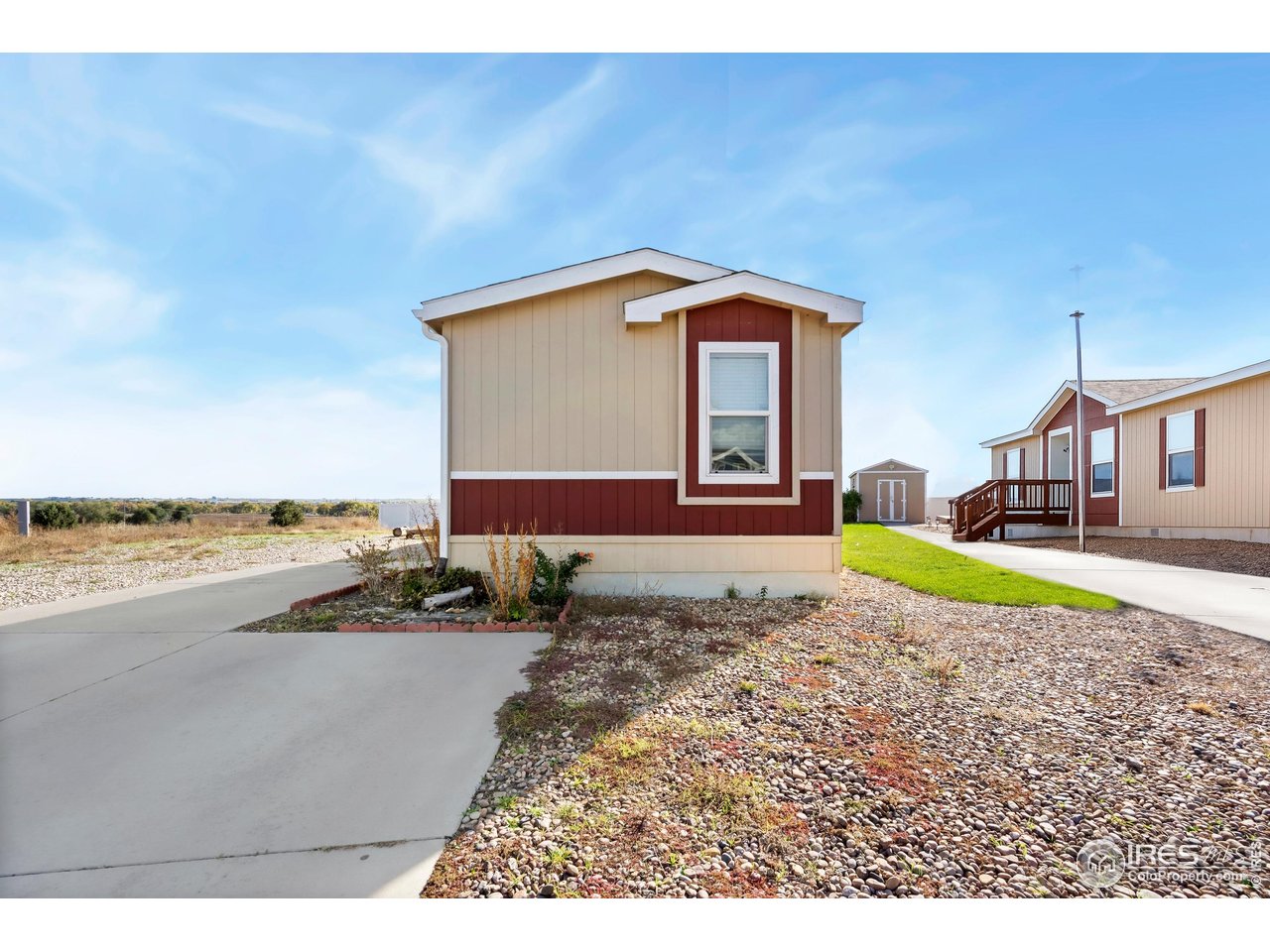 4324 Buffalo Trail Evans, CO 80620 - Photo 6 of 16 a view of a house with a swimming pool