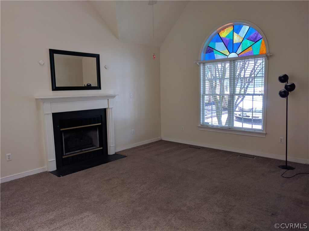 3103 Gregwood Road Midlothian, VA 23112 - Photo 11 of 26 an empty room with windows and fireplace