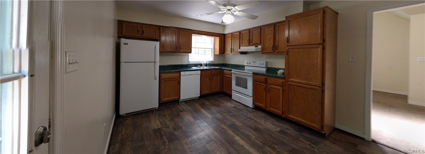 3103 Gregwood Road Midlothian, VA 23112 - Photo 14 of 26 a kitchen with stainless steel appliances granite countertop white cabinets a refrigerator a sink a stove and a wooden floors