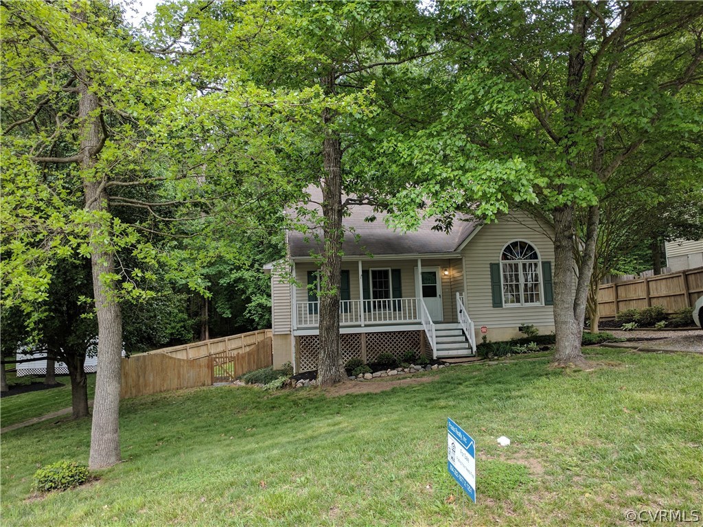 3103 Gregwood Road Midlothian, VA 23112 - Photo 3 of 26 a front view of a house with a garden