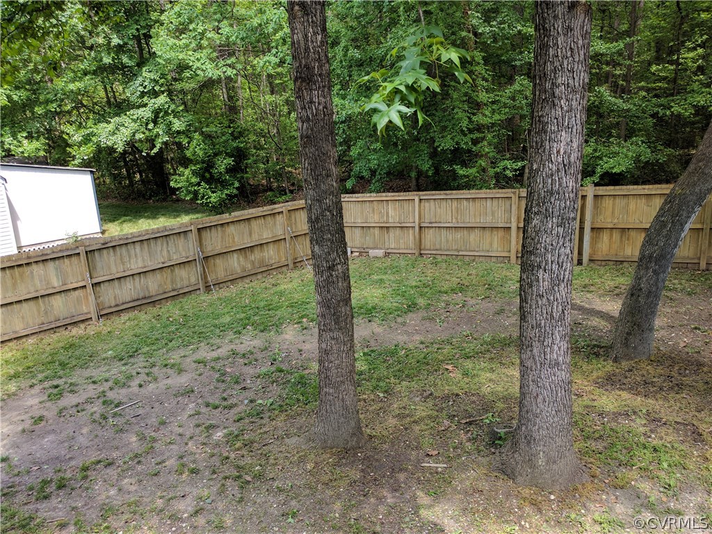 3103 Gregwood Road Midlothian, VA 23112 - Photo 6 of 26 a backyard of a house