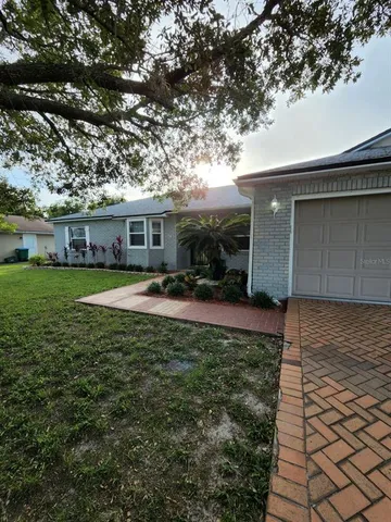 a view of a house with a yard