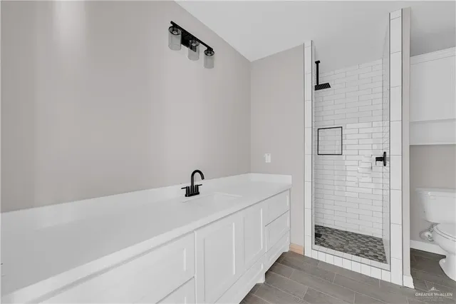 a bathroom with a sink and shower