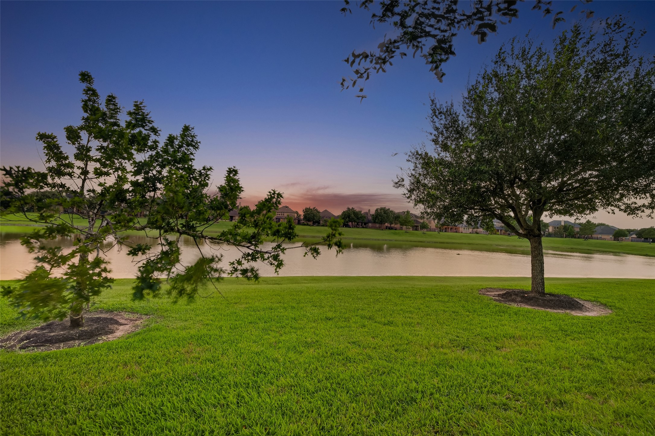 7930 Summer Night Lane Rosenberg, TX 77469 - Photo 46 of 48 Serene water views and expansive green space create a peaceful outdoor setting.