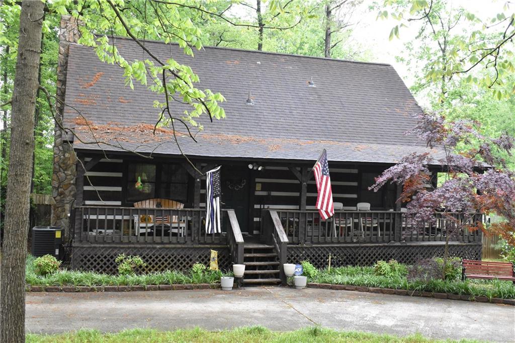 front view of a house with potted plants