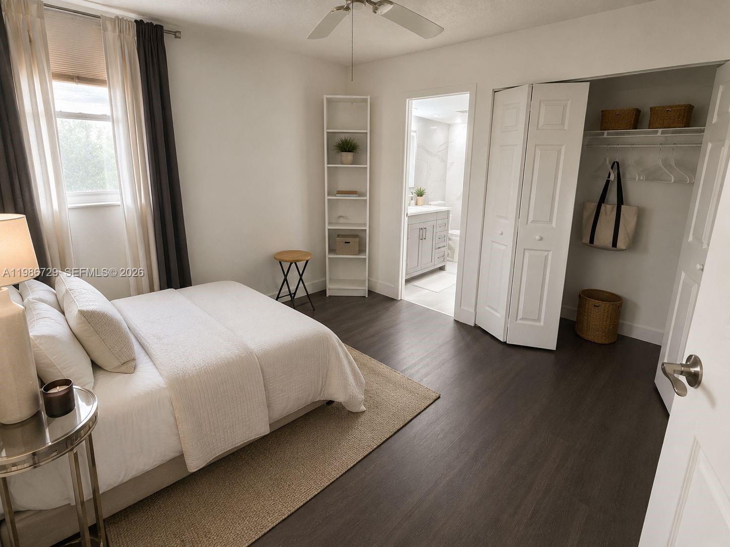 299 Northwest 52nd Terrace, Unit PHX Boca Raton, FL 33487 - Photo 7 of 16 a bedroom with a bed and a walk in closet