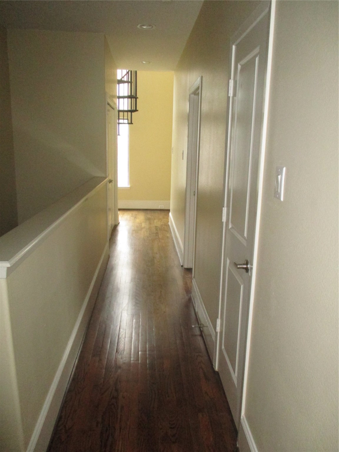 703 St Charles Street Houston, TX 77003 - Photo 11 of 24 a view of a hallway with wooden floor