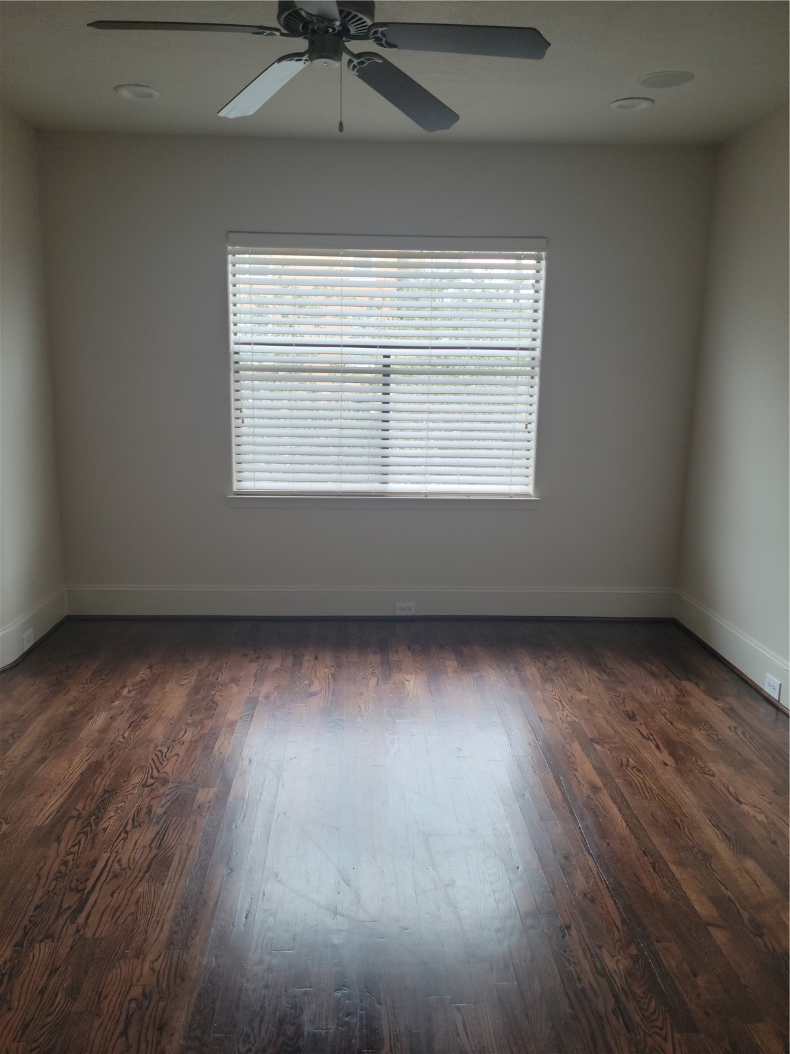 703 St Charles Street Houston, TX 77003 - Photo 18 of 24 an empty room with wooden floor and windows