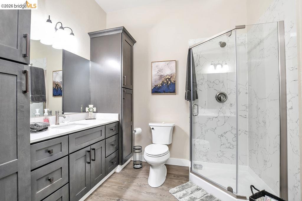 2200 Delta Road Knightsen, CA 94548 - Photo 11 of 26 Bathroom featuring vanity, a marble finish shower, and light wood-style floors