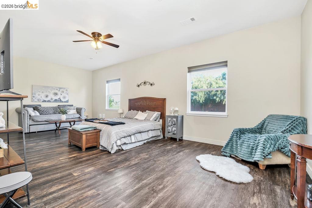 2200 Delta Road Knightsen, CA 94548 - Photo 16 of 26 Bedroom featuring multiple windows, dark wood-style flooring, and ceiling fan