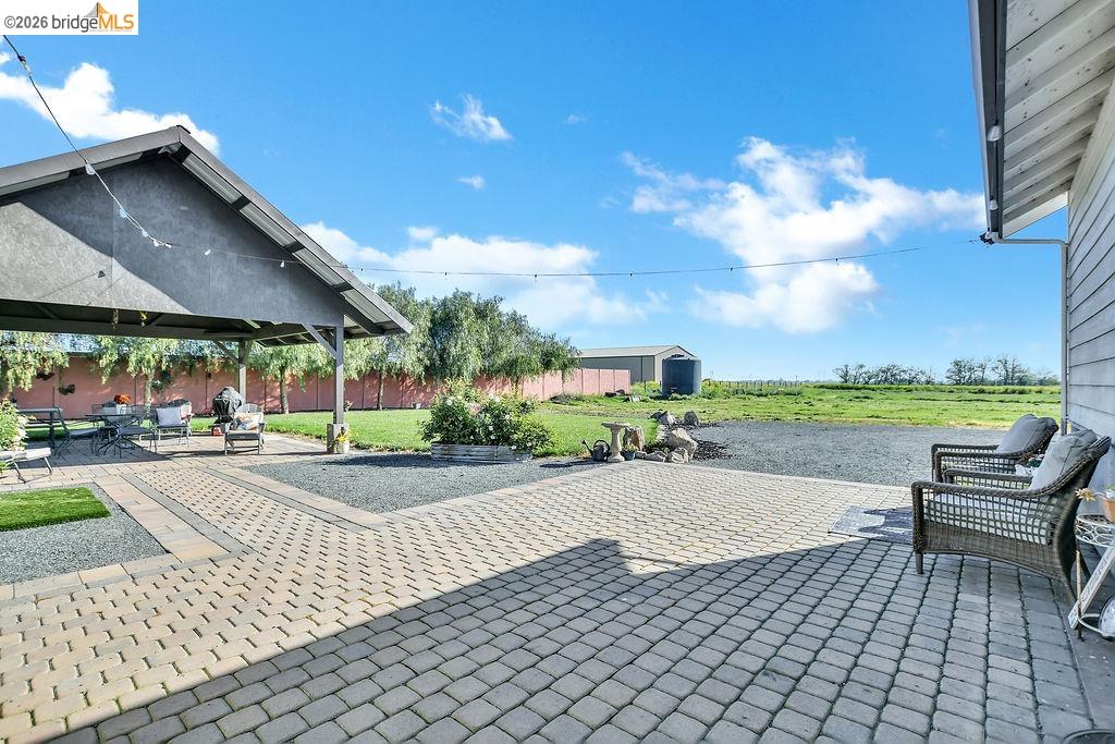 2200 Delta Road Knightsen, CA 94548 - Photo 18 of 26 Fenced backyard featuring a patio area and a storage shed