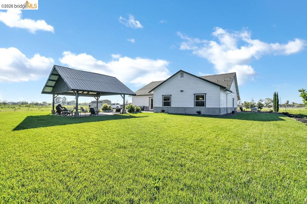 2200 Delta Road Knightsen, CA 94548 - Photo 20 of 26 View of side of home with a yard and a patio area