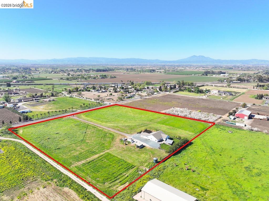 2200 Delta Road Knightsen, CA 94548 - Photo 24 of 26 View of rural area with property parcel outlined, rows of crops, and mountains