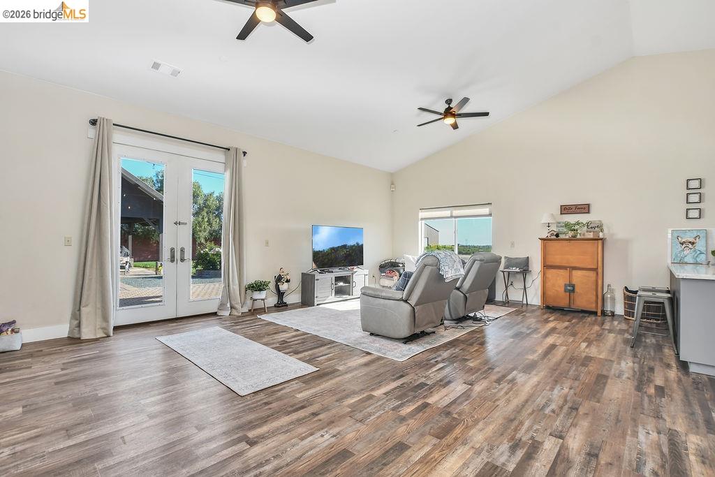 2200 Delta Road Knightsen, CA 94548 - Photo 5 of 26 Living room with vaulted ceiling, ceiling fan, dark wood-style floors, and french doors