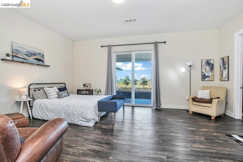 2200 Delta Road Knightsen, CA 94548 - Photo 10 of 26 Bedroom featuring dark wood-style floors and access to exterior