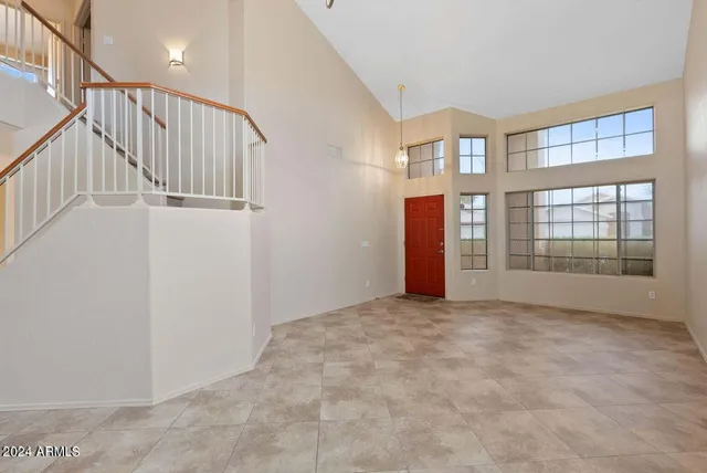 a bathroom with a shower sink and mirror