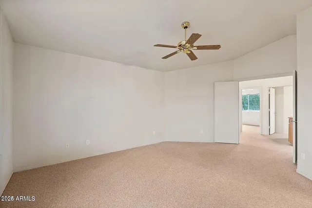 a view of an empty room and window