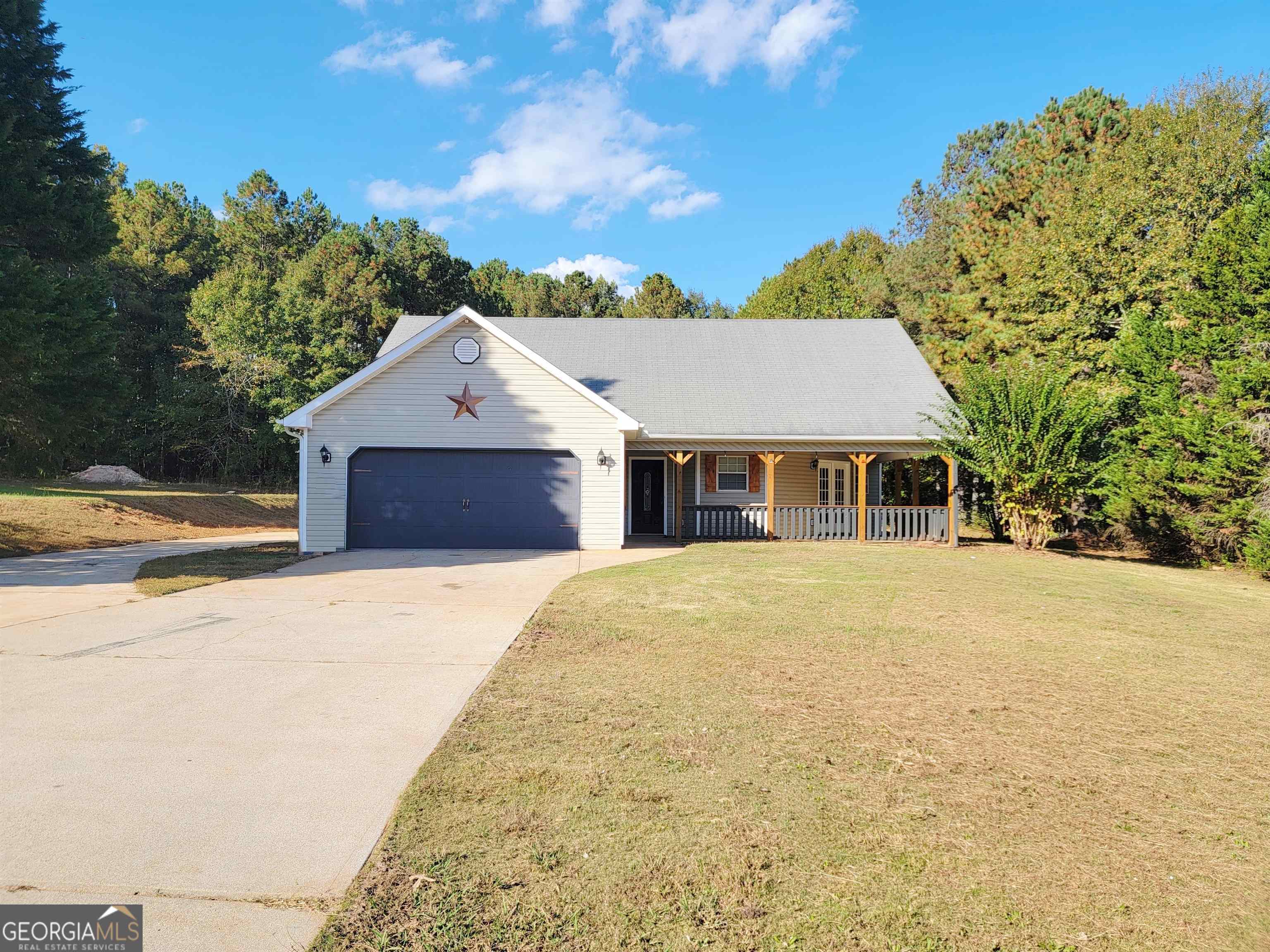 60 Chestnut Drive Covington, GA 30016 - Photo 1 of 1 a front view of a house with a yard