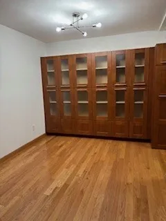 a view of an empty room with cabinet