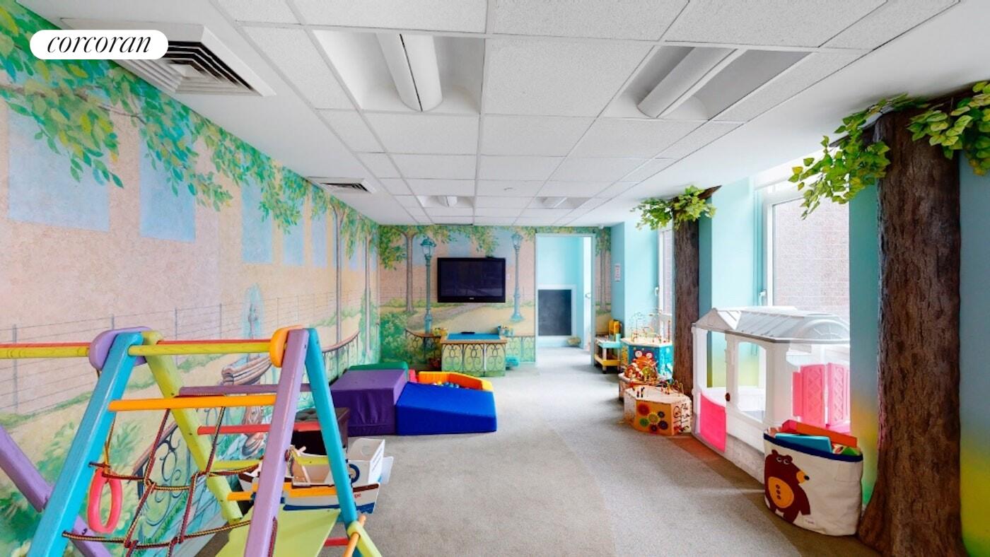 11 East 29th Street, Unit 24C Manhattan, NY 10016 - Photo 15 of 17 a living room with furniture and a flat screen tv