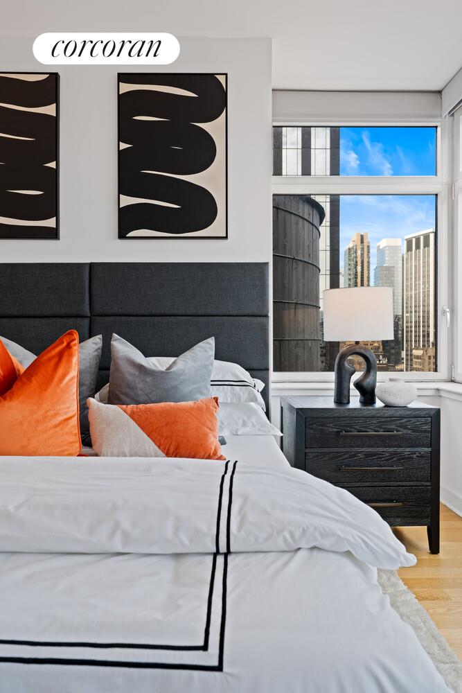 11 East 29th Street, Unit 24C Manhattan, NY 10016 - Photo 7 of 17 a bedroom with bed and cabinets