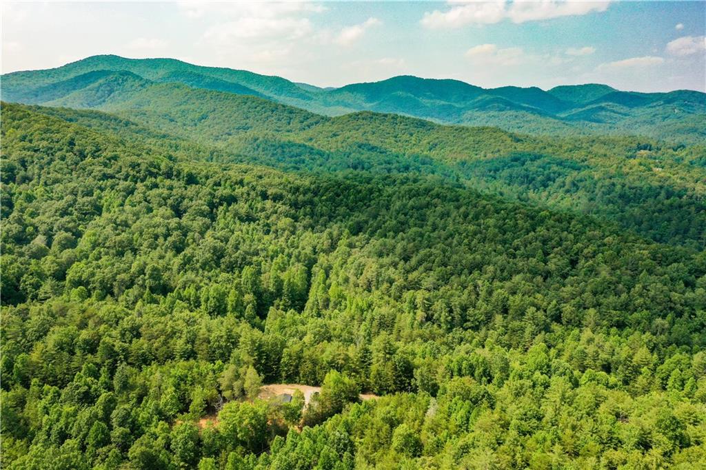 0 Flagpole Circle Ellijay, GA 30540 - Photo 2 of 5 a view of a lush green hillside and a building