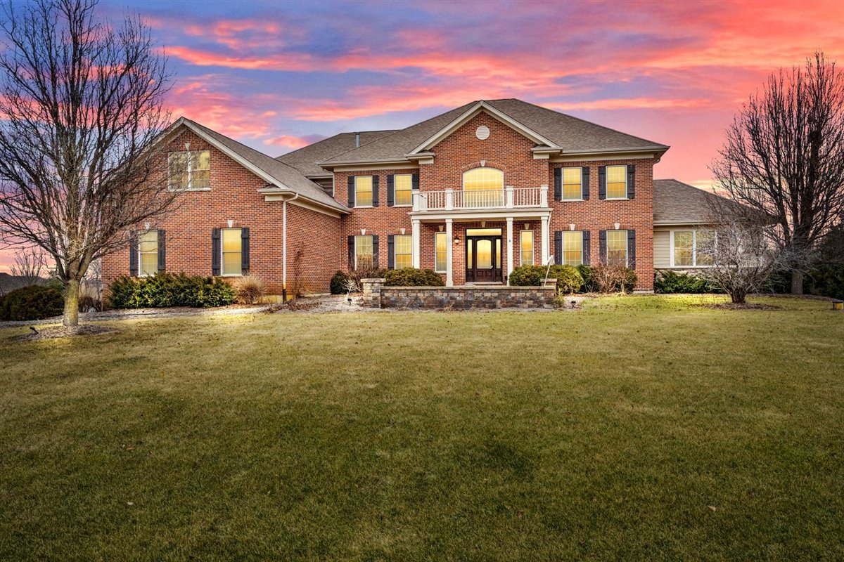 1-n203 East Blackberry Crossing Circle Elburn, IL 60119 - Photo 1 of 30 a front view of a house with a yard