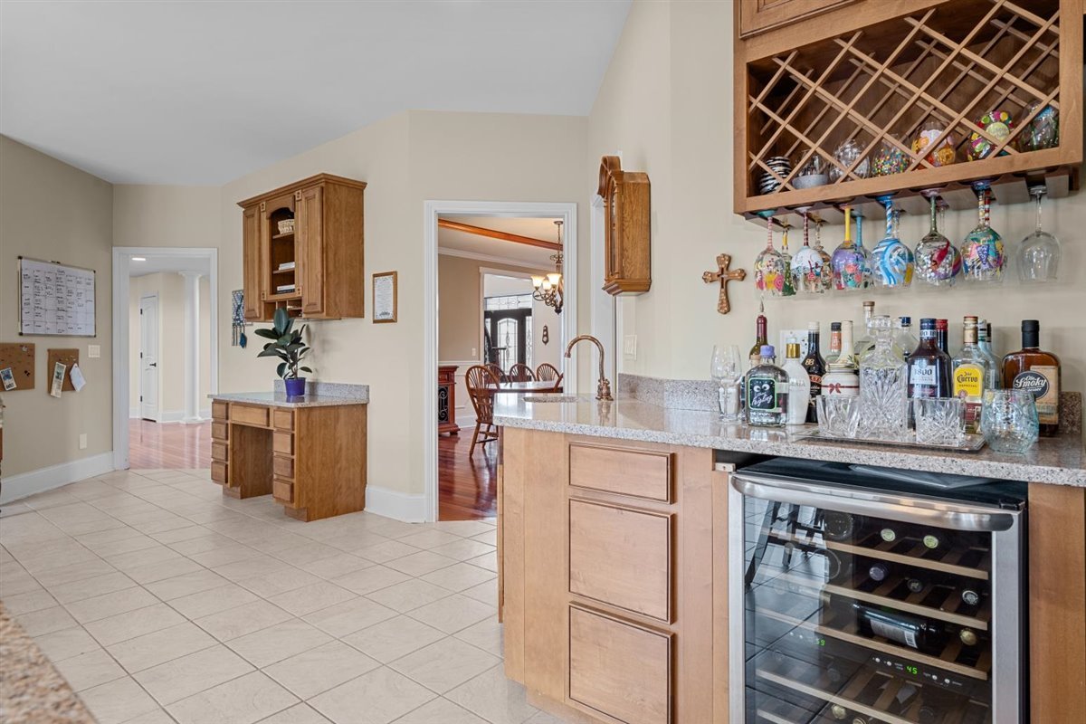 1-n203 East Blackberry Crossing Circle Elburn, IL 60119 - Photo 12 of 30 a kitchen with stainless steel appliances granite countertop a sink and cabinets