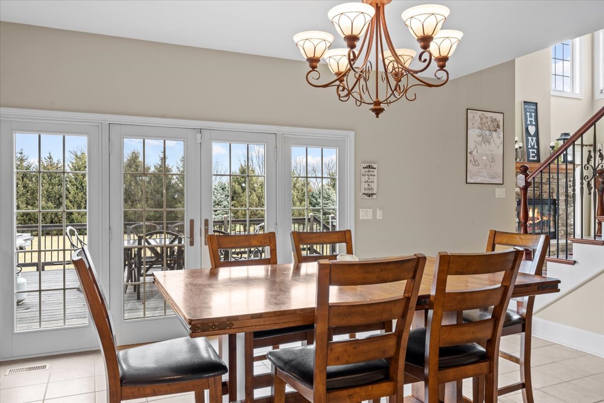 1-n203 East Blackberry Crossing Circle Elburn, IL 60119 - Photo 13 of 30 a view of a dining room with furniture window and outside view