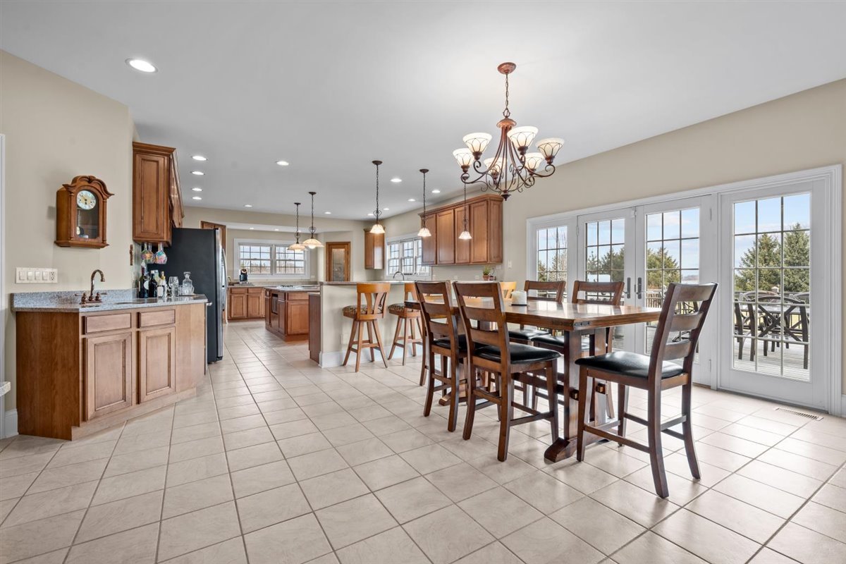 1-n203 East Blackberry Crossing Circle Elburn, IL 60119 - Photo 14 of 30 a view of a dining area with furniture