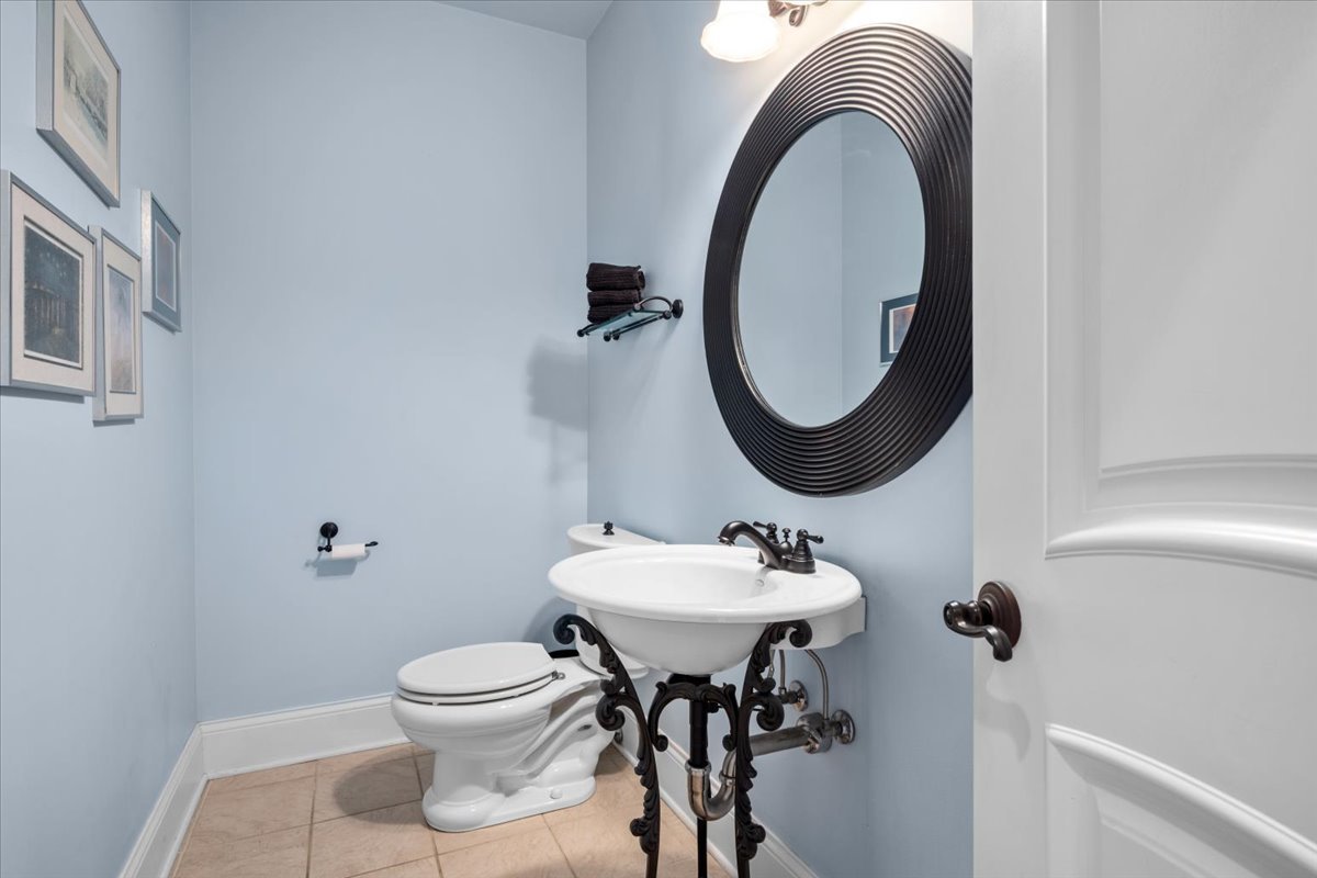 1-n203 East Blackberry Crossing Circle Elburn, IL 60119 - Photo 15 of 30 a bathroom with a toilet sink and mirror