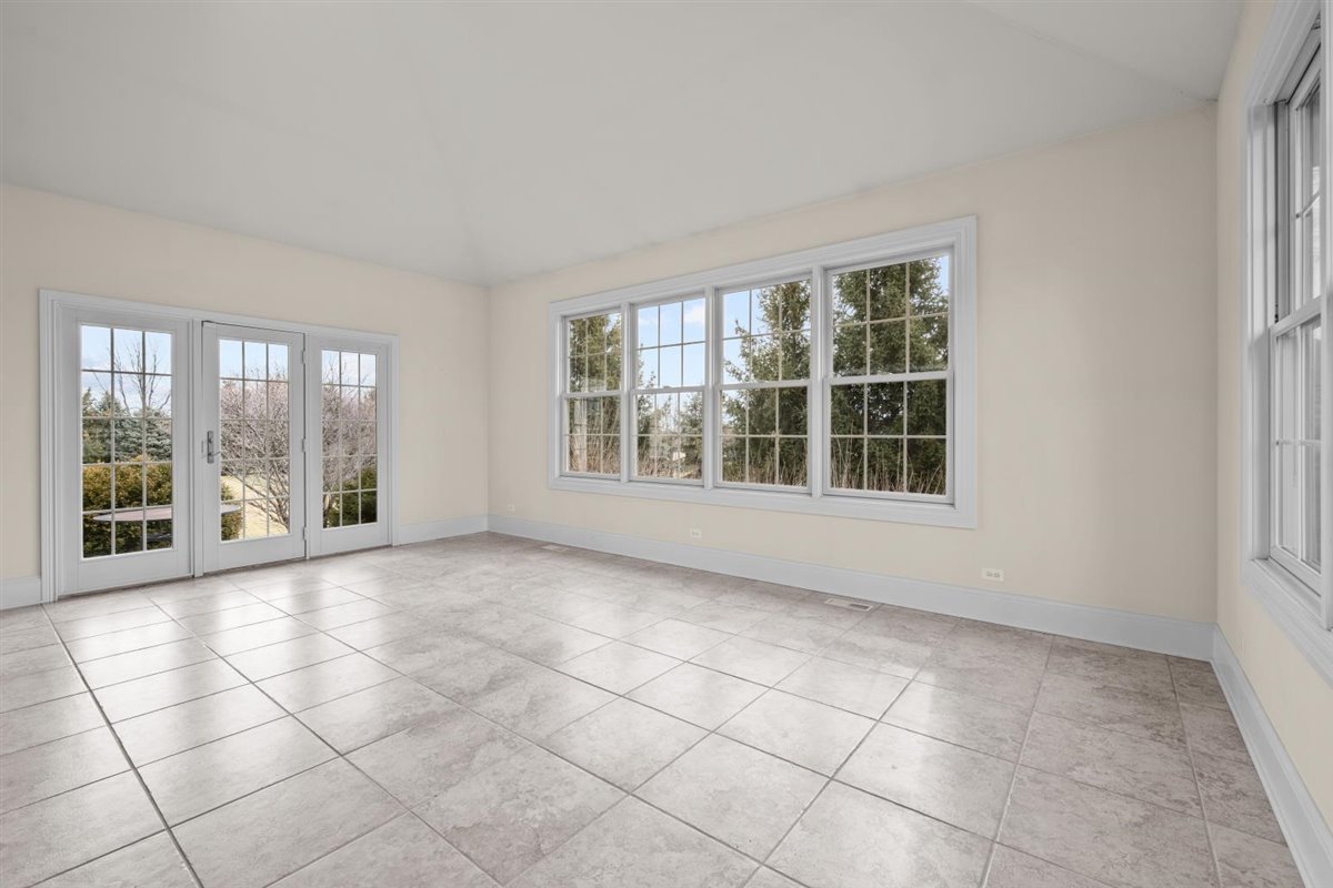 1-n203 East Blackberry Crossing Circle Elburn, IL 60119 - Photo 18 of 30 a view of an empty room with a window
