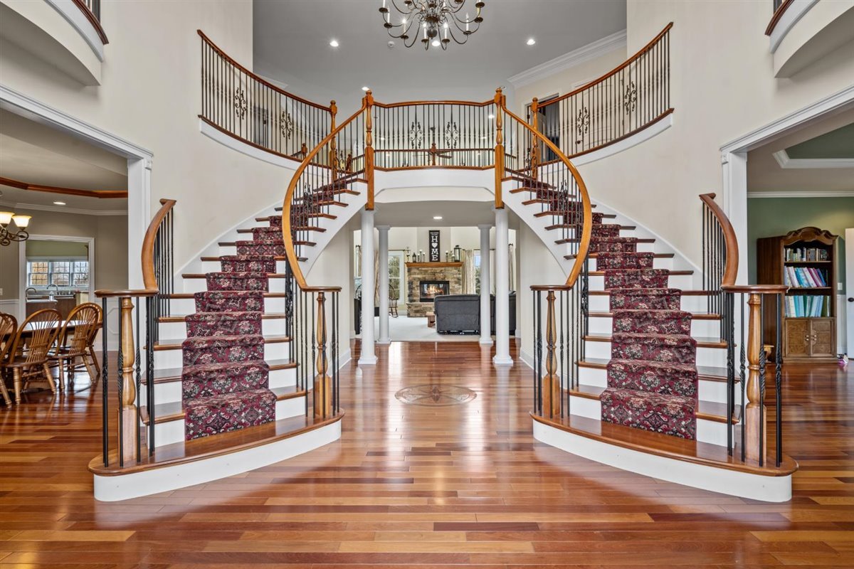 1-n203 East Blackberry Crossing Circle Elburn, IL 60119 - Photo 2 of 30 a view of entryway and hall with wooden floor