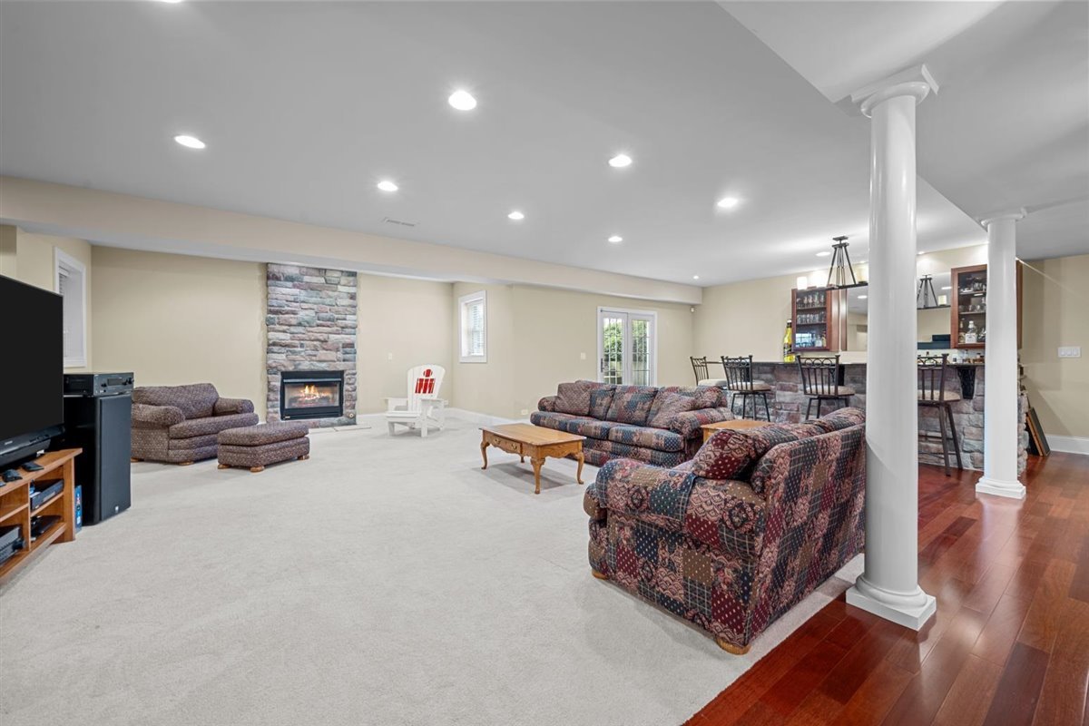 1-n203 East Blackberry Crossing Circle Elburn, IL 60119 - Photo 25 of 30 a living room with furniture and a flat screen tv