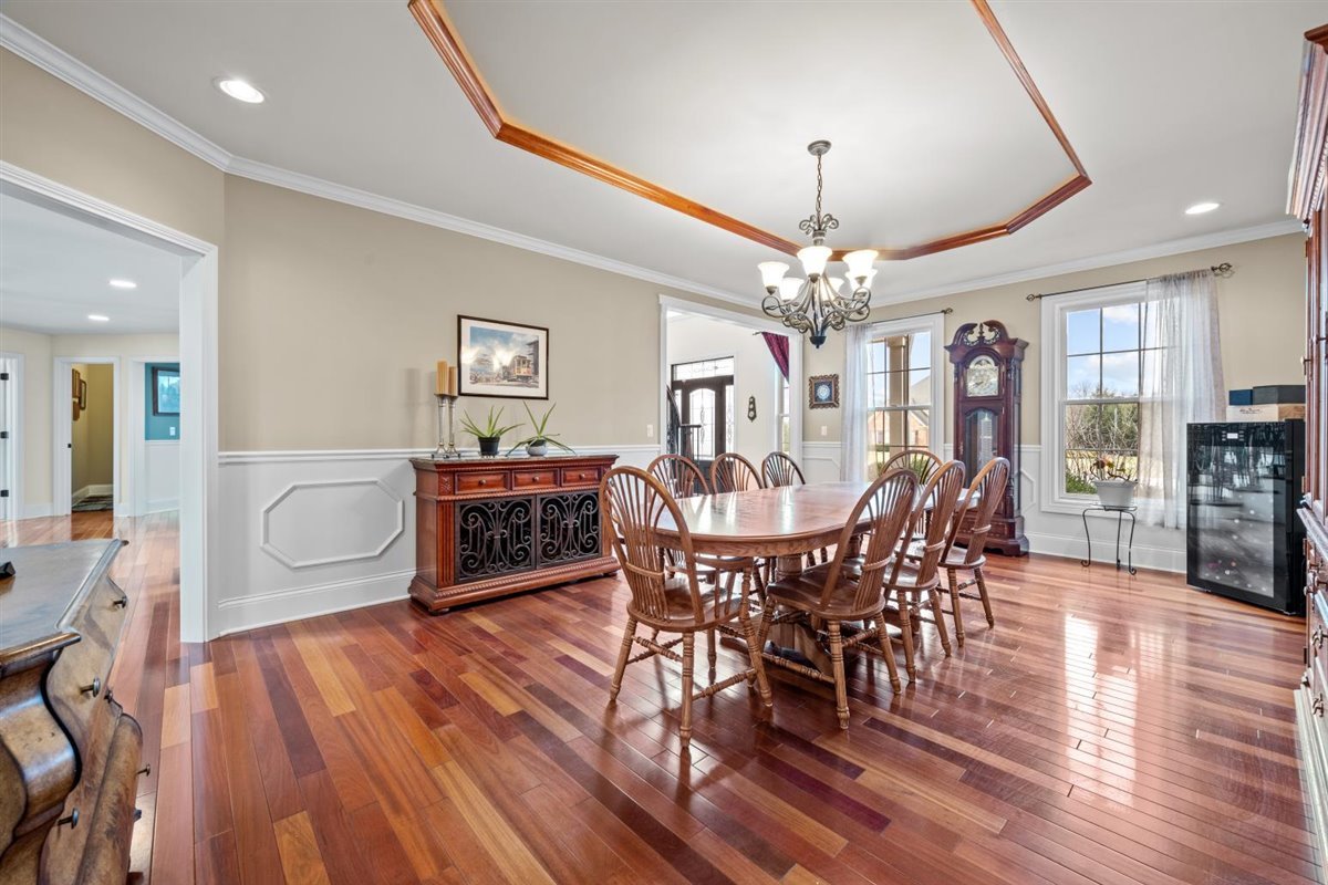 1-n203 East Blackberry Crossing Circle Elburn, IL 60119 - Photo 3 of 30 a view of a dining room with furniture window and wooden floor