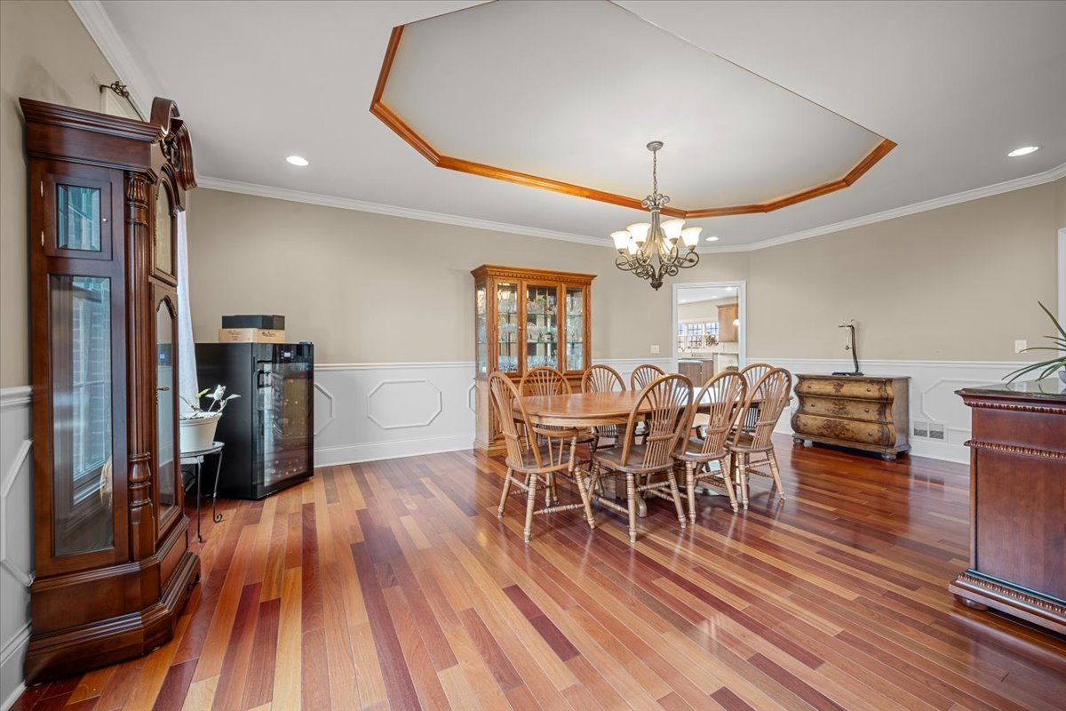 1-n203 East Blackberry Crossing Circle Elburn, IL 60119 - Photo 4 of 30 a dining room with furniture entryway and wooden floor