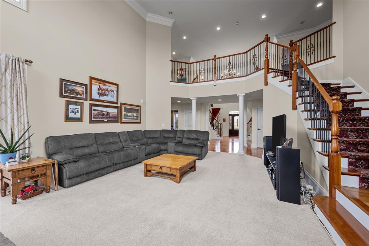 1-n203 East Blackberry Crossing Circle Elburn, IL 60119 - Photo 6 of 30 a living room with furniture and a chandelier